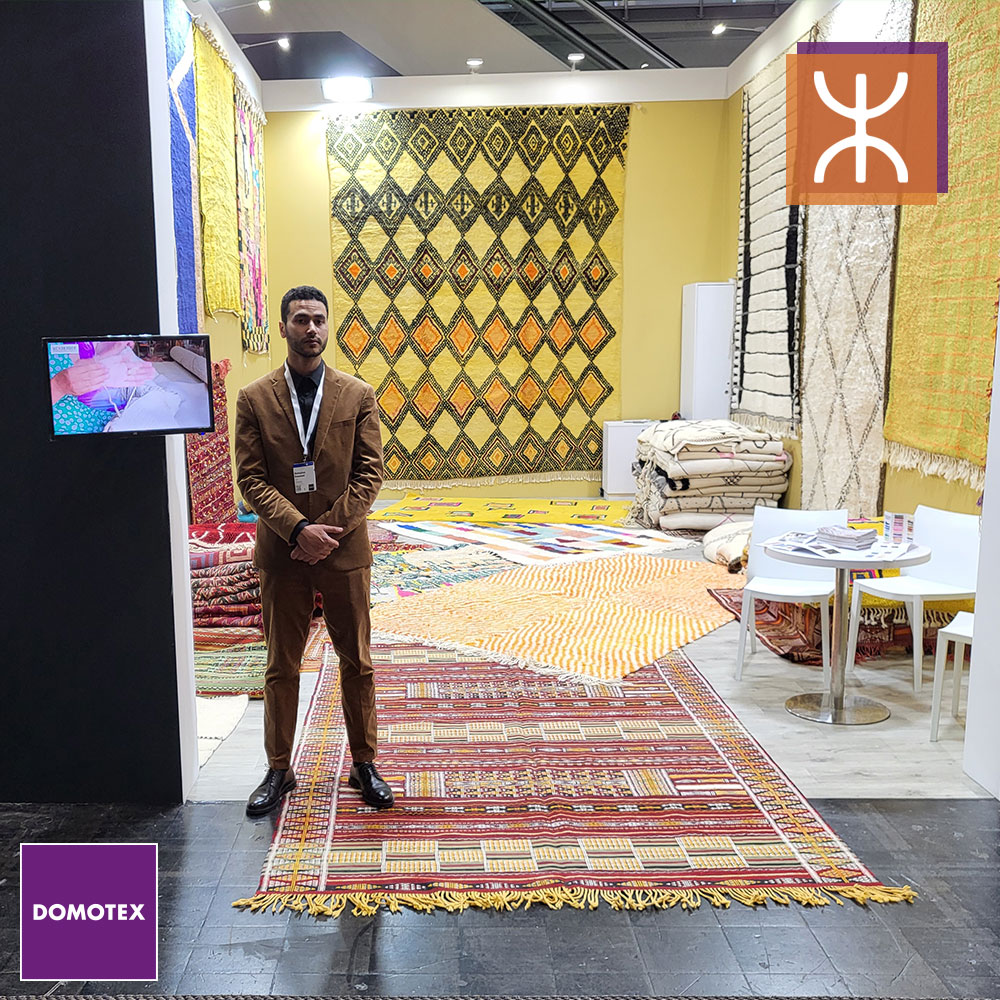 a man standing in front of a rug. DOMOTEX-2023-2.0_03