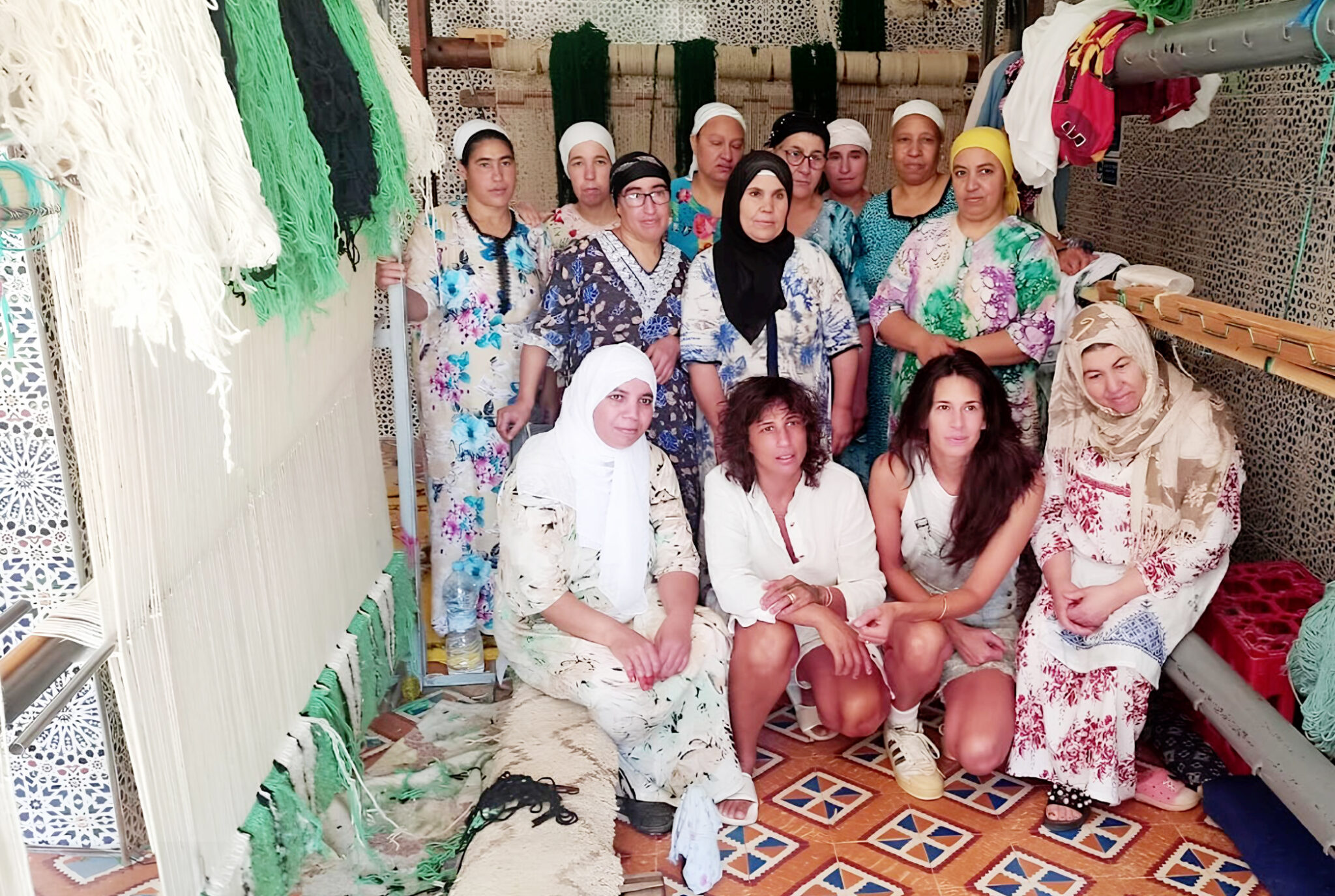 a group of women sitting on the floor. WEBERBER WEAVERS 2023-02-27